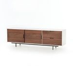 Angled view highlighting the contrast between white lacquer frame and walnut panels