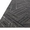 Side angle showing low pile wool and rayon texture with layered linear design in graphite and blue