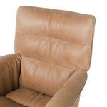 Close-up of upper back cushion showing subtle creases and natural leather grain