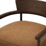 Close-up of linen fabric texture and wood grain on arm rail
