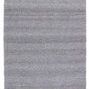 Solid gray and white handwoven indoor/outdoor rug with tassels on short ends, flat textured surface