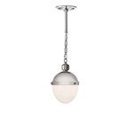 Otis Pendant Small shown lit with soft warm glow from milk glass shade