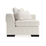 Direct side view emphasizing textured upholstery and cushion placement over dark legs