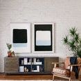 Paired abstract paintings hung above metal and wood cabinet with mid-century modern leather chair and green plants