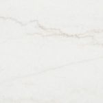 Close-up detail of creamy white marble tabletop surface with light natural veining