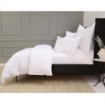 Side view of queen bed with Langston Bamboo Sateen Duvet Set showing draped duvet and flat sheet