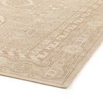 Close angle highlighting the subtle color gradation and corner edge stitching of the rug
