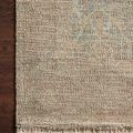 Priya Denim Rust Rug with hand-woven tonal design in rust, blue, and beige hues, featuring a textured weave and fringed edges