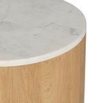 Close-up of marble surface rounded edge meeting the oak wood base
