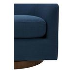 Close-up of chair seat cushion corner and adjacent fabric with base edge at bottom