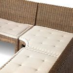 Close-up showing dining banquette's tufted cushions and woven rattan on seating bends
