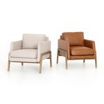 Two Diana Chairs side-by-side; one in ecru fabric, the other in tan leather