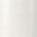 Close-up of shiny golden brass upper base paired with off-white linen shade
