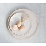 Set of two round plates with white enamel centers and mango wood rims, holding three eggs and dried plant