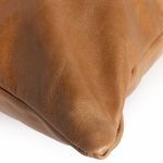 Close-up on pillow point corner with leather panel and stitched seams
