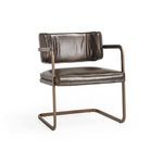 Fonda Dining Chair with cantilever hollow tube frame and brown leather upholstery accented by welted detailing