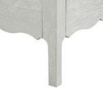 Close-up of desk leg showing cerused oak wood grain and carved scalloped detailing