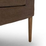Close-up of tapered solid oak banquette leg finished in amber oak tone