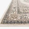 Side angle view showing the rug's low pile texture and clean finished edge
