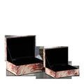 Open boxes revealing black felt interiors with lids held upright