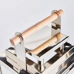 Close-up of natural teak handle mounted on polished chrome brackets of outdoor lantern