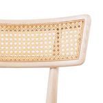 Detailed view of octagonal cane pattern on the backrest framed by bleached wood