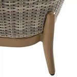 Close-up of the loveseat’s light wood leg and base highlighting natural wood grain texture