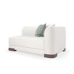 Single modular section with rounded arm and two decorative pillows in white and patterned aqua
