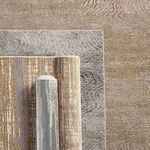 Stacked rugs including Dune rug, highlighting varied modern patterns and colorways