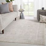 Lifestyle scene with rug underliving room seating area featuring light wood flooring