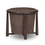 Kernan Basket with woven brown basket nested in a solid teak round frame with tapered legs
