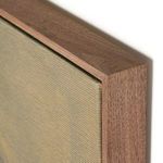 close-up of the wooden frame corner showing natural wood grain texture around the canvas edge
