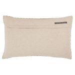 Back of pillow with beige fabric and small brand label at top right corner