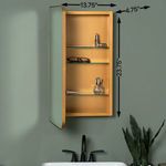 Cabinet open on wall from side angle showing 13.75 inch depth, 23.75 inch height and 4.75 inch door thickness