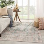 Bardia rug in bright room with beige sofa, wooden side table, and blush accent pillow