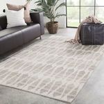 Close-up texture showing plush wool fibers and precise geometric shapes in light gray