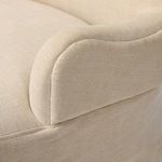 Omar Chair in ambient lighting showcasing linen fabric texture and silhouette