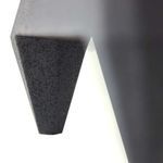 Extreme close-up of one pointed leg and angular underside of Tiago Sculpture