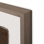 Close-up of wood frame corner showing natural grain and textured edges of canvas