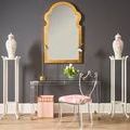 Regency hall chair styled in room with clear acrylic console table, pink patterned seat cushion, floral décor
