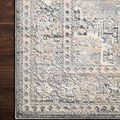 Detailed close-up of Lucia Grey / Sunset rug edge showing delicate pattern and pile texture