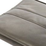 Top close-up of padded seat with horizontal stitching lines and leather grain detail