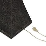 Close-up bottom view of textured black tapered base showing square footprint