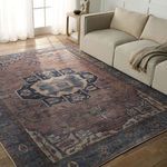 Barrymore rug styled in living room with beige sofa and hardwood floor under natural light