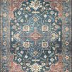 Skye Denim Brick Rug with a central medallion, rich denim blue background, brick red border, and ornate floral motifs