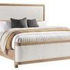 Form California King Bed angled view highlighting the curved wood trim and fabric texture