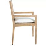 Side view showing the slim teak armrest and white cushion profile