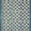 Rectangular Mika Blue / Ivory Rug with an abstract tribal-inspired geometric pattern in blue and ivory, textured yarn