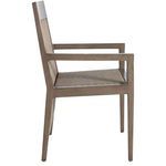 Side view of Savannah arm chair in oak finish showing woven raffia seat and back without cushion