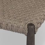 Detailed corner close-up showing tightly wrapped chunky woven rope around rounded leg